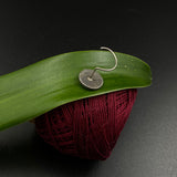 Abstract in a circle Nose Pin
